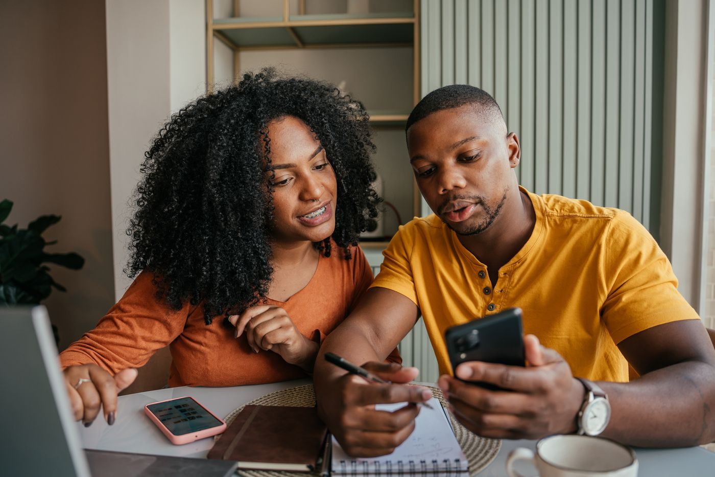 A couple reviewing their plan together at home